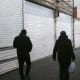 People walk through an empty marketplace with closed vendors; Ali Velshi.