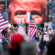 President Trump's closeup photo seen on video screens in front of a crowd at a rally.
