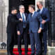 British Prime Minister Keir Starmer (second from left) says goodbye to Ukrainian President Volodymyr Zelenskyy (left), French President Emmanuel Macron (second from right) and German Chancellor Friedrich Merz after a meeting on Dec. 8, 2025, in London.