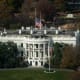 A photo of the white house front face shot from above.