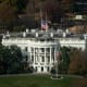 A photo of the white house front face shot from above.