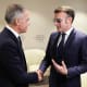 France's President Emmanuel Macron (right) shakes hands with Canada's Prime Minister Mark Carney at the World Economic Forum on Jan. 20, 2026, in Davos, Switzerland.