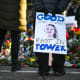 A person holds a sign reading "Good Rest in Power" during a vigil on Jan. 14, 2026, in Minneapolis.