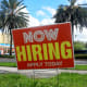 A “Now Hiring” sign is posted outside a business on Oct. 3, 2025, in Miami.