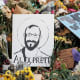 Signs and flowers left by mourners at the makeshift memorial for Alex Pretti on Jan. 29, 2026, in Minneapolis.
