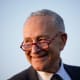 Chuck Schumer smiles.