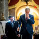 Mike Johnson, left, and John Thune leave. Press can be seen in the background.