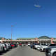 A plane flies over El Paso International Airport.