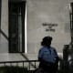 A police officer stands guard outside the US Department of Justice building in Washington, D.C.