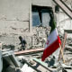 An unidentified man among the ruins of a police station that is struck during U.S.-Israeli attacks in Tehran.