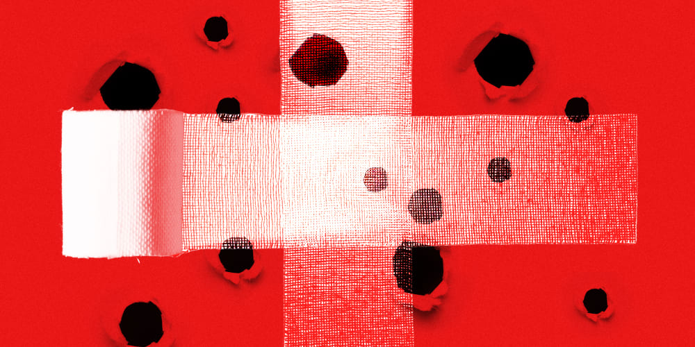 Photo illustration of two bandages crossing each other at the centre, covering a red surface with holes.