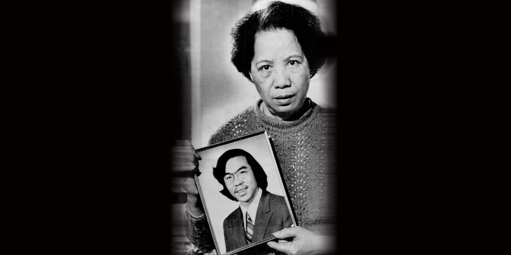 Image: Lily Chin holds a photograph of her son Vincent Chin.