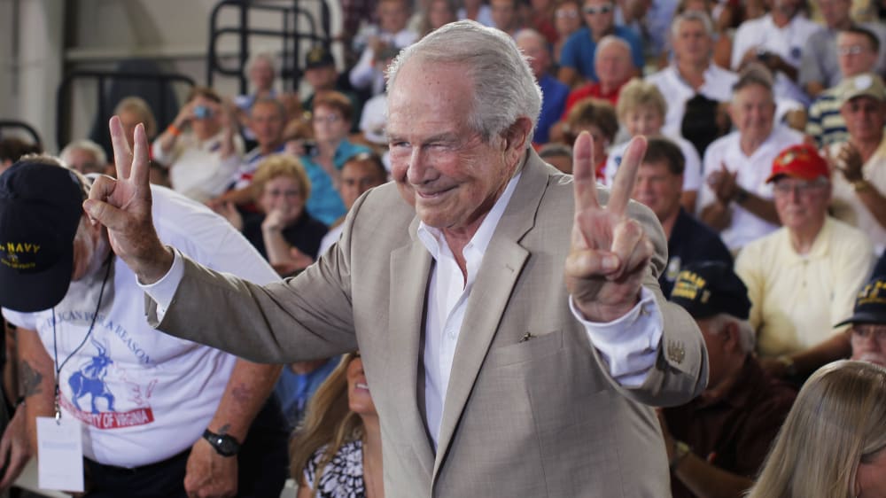 Evangelist Pat Robertson acknowledges the audience before he takes a seat before Republican presidential candidate Mitt Romney campaigns in Virginia Beach, Va., on Sept. 8, 2012.