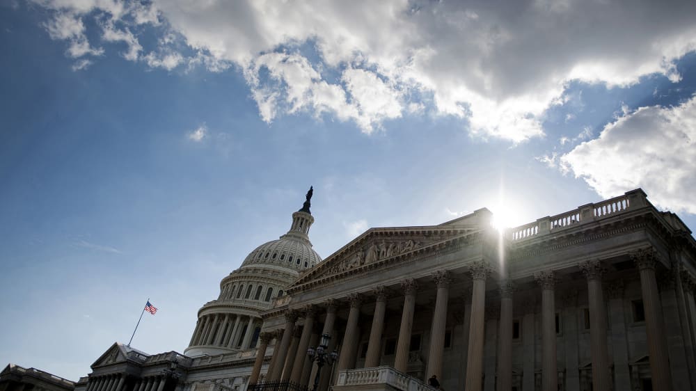 The sun begins to set behind the US Capitol in Washington, D.C.