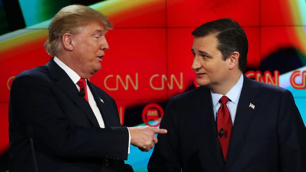 Republican presidential candidates Donald Trump and Sen. Ted Cruz, interact at the conclusion of the CNN republican presidential debate at The Venetian Las Vegas on Dec. 15, 2015 in Las Vegas, Nev. (Photo by Justin Sullivan/Getty)