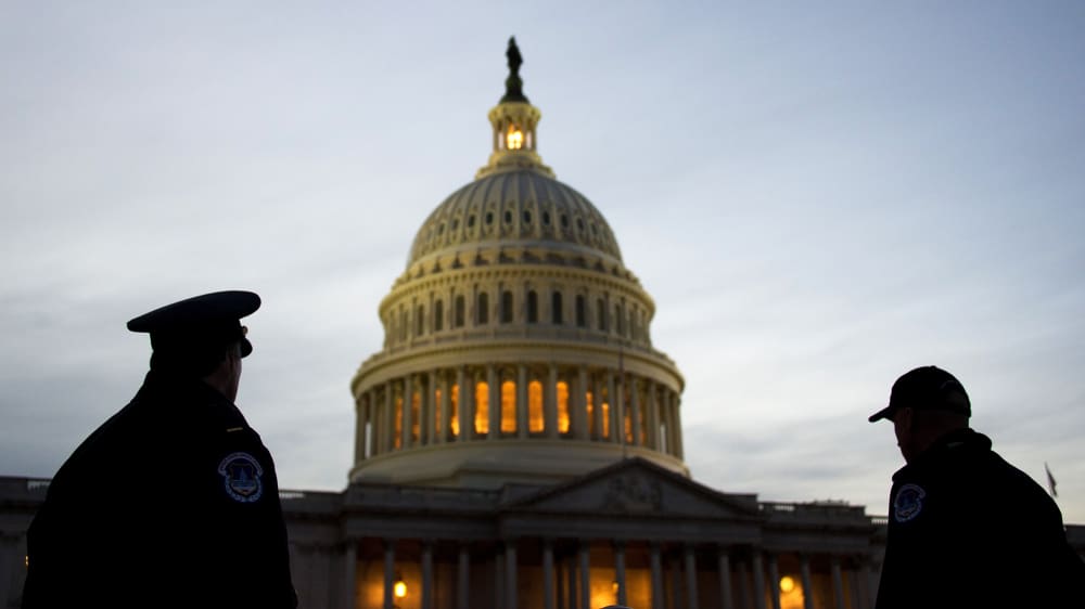 US Capitol Police stand guard in front of the US Capitol in Washington, DC, Feb. 12, 2013. (Photo by Jim Watson/AFP/Getty)