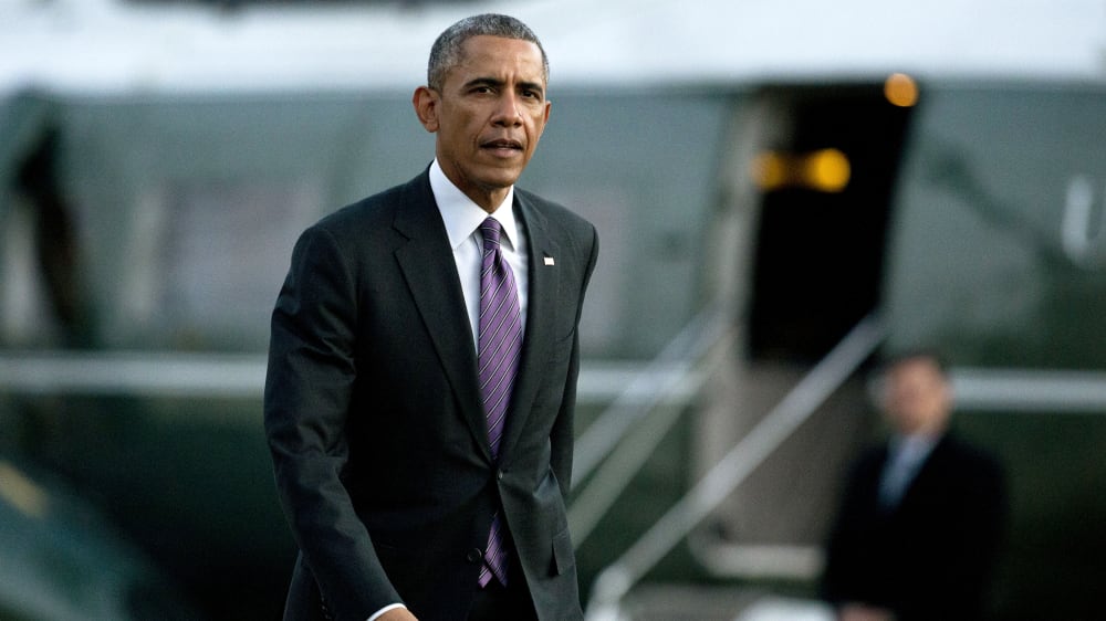 President Barack Obama walks from Marine One across the South Lawn to the Oval Office of the White House, Jan. 15, 2015, in Washington, D.C. (Photo by Carolyn Kaster/AP)
