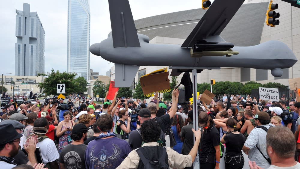 Protesters carry a replica of military drone plane during a demonstration in Charlotte, North Carolina, September 4, 2012 ahead of the opening of the Democratic National Convention.