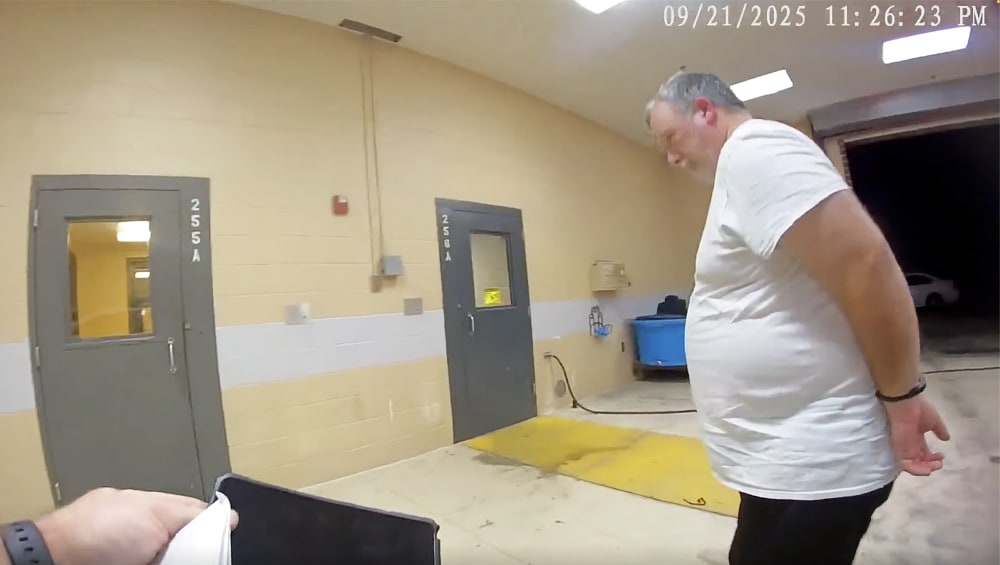 Larry Bushart in handcuffs from the police body cam footage.