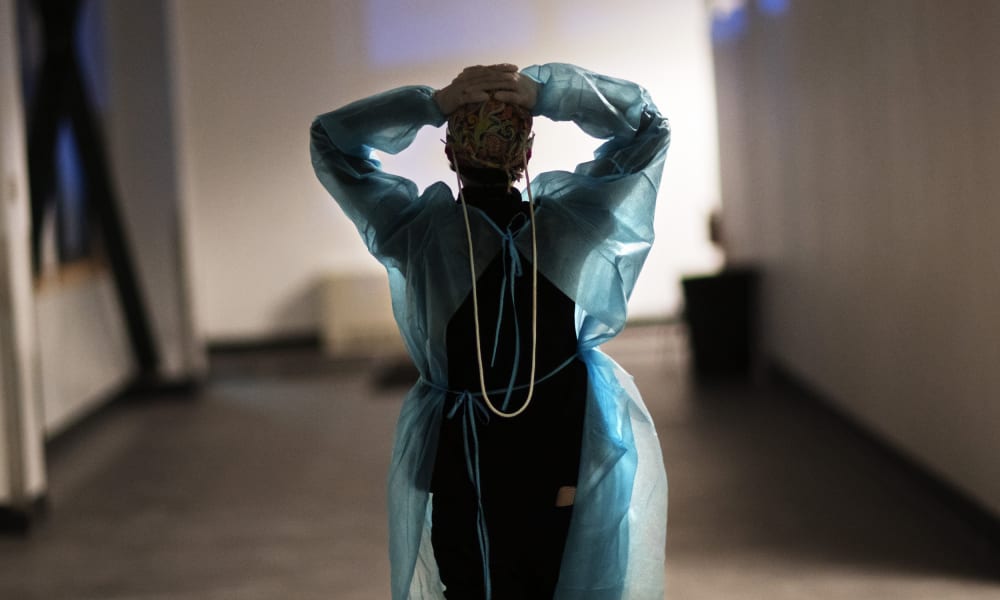Image: A nurse walks down the hallway of a hospital