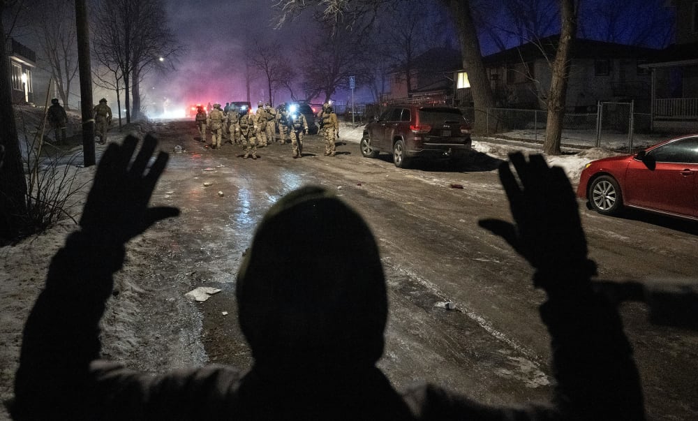 Federal law enforcement officers during confrontations with residents in Minneapolis.