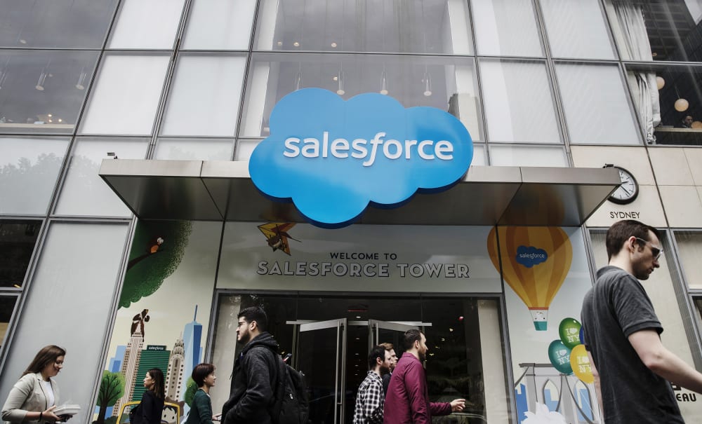Image: Pedestrians pass in front of the Salesforce Tower in New York on May 30, 2019.