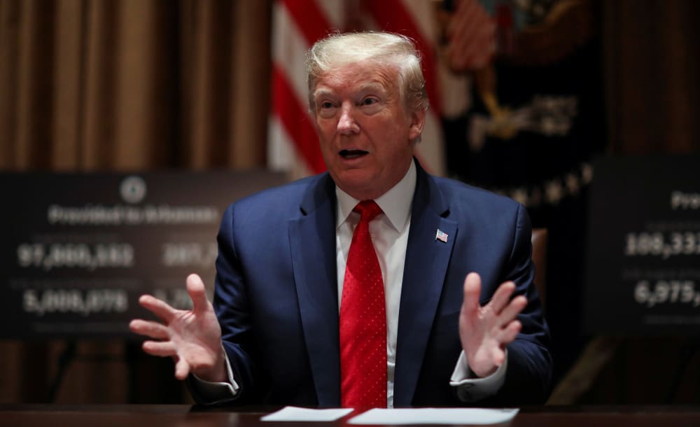 Image: President Donald Trump speaks about the coronavirus disease (COVID-19) pandemic response during a meeting with Kansas Governor Laura Kelly and Arkansas Governor Asa Hutchinson in the Cabinet Room at the White House