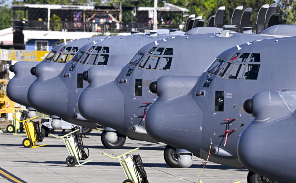 US Air Force MC-130 Hercules aircrafts sit on a tarmac on Dec. 29, 2025 at Rafael Hernandez Airport in Aguadilla, Puerto Rico. The United States has deployed a major military force in the Caribbean and has recently intercepted oil tankers as part of a naval blockade against Venezuelan vessels it considers to be under sanctions.