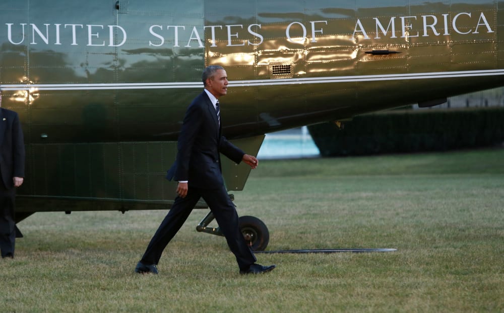 U.S. President Barack Obama walks on the South Lawn of the White House in Washington after a one day trip to Jacksonville, Fl., Feb. 26, 2016. (Photo by Yuri Gripas/AFP/Getty)