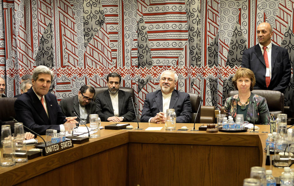 U.S. Secretary of State John Kerry (L), Foreign Minister of Iran Mohammad Javad Zarif (C) and EU High Representative for Foreign Affairs and Security Policy Catherine Ashton (R) during a meeting at the United Nations headquarters in New York City, Septemb