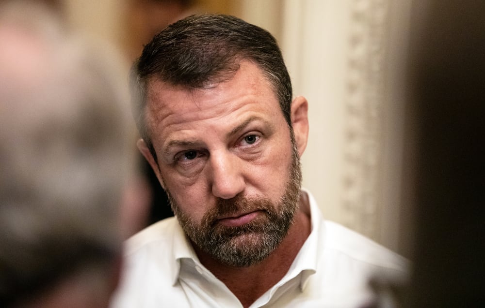 Sen. Markwayne Mullin speaks to reporters on Capitol Hill.