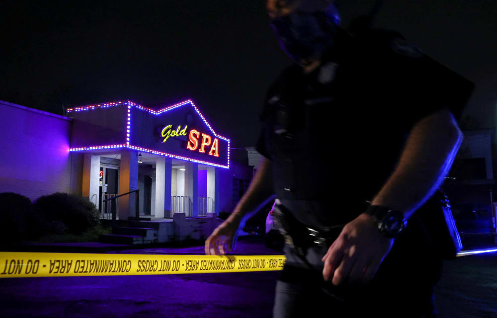 Image: A police officer at the taped scene outside of Gold Spa in Atlanta, Georgia.