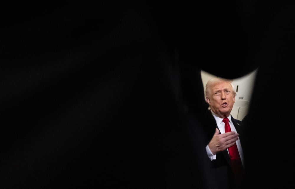 President Trump speaks to reporters on Air Force One.