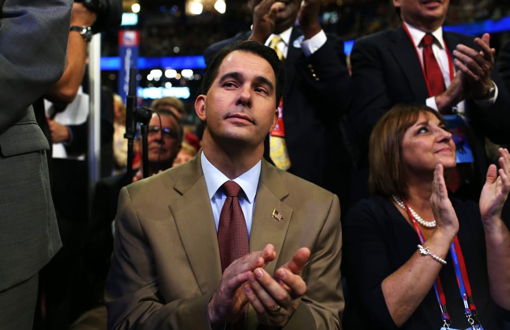 Wisconsin Gov. Scott Walker claps during the third day of the Republican National Convention at the Tampa Bay Times Forum on Aug. 29, 2012 in Tampa, Fla.