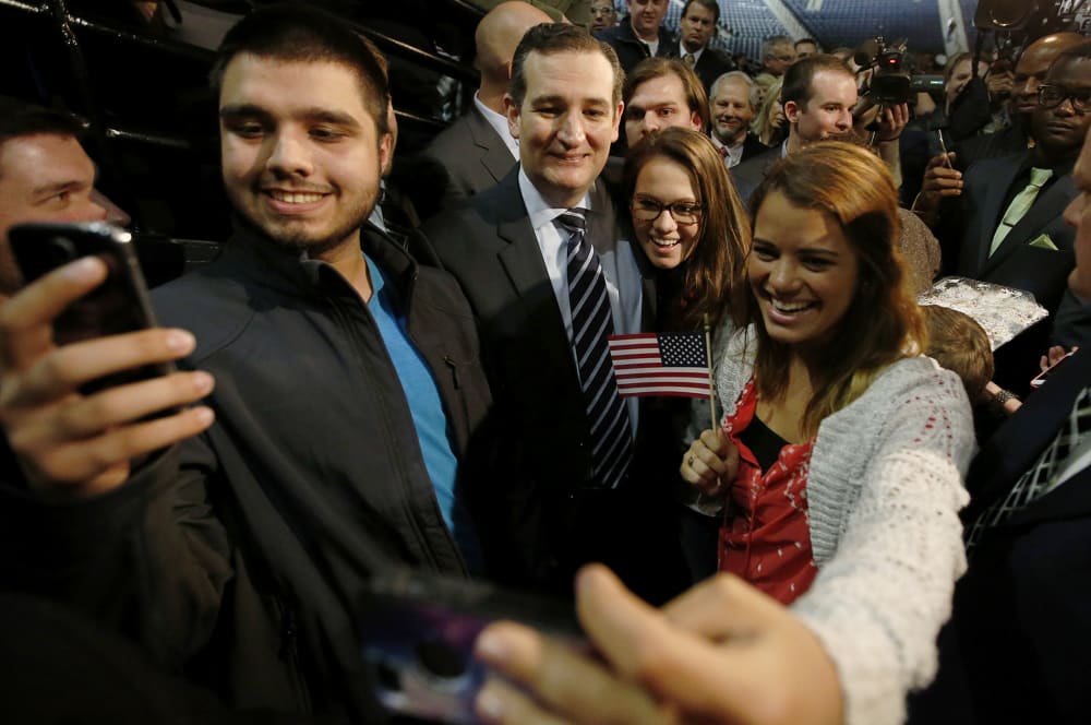 US Senator Ted Cruz (R-TX) poses for pictures with students shooting "selfies" after confirming his candidacy for the 2016 presidential election race during a speech at Liberty College in Lynchburg, Va., March 23, 2015. (Photo by Chris Keane/Reuters)