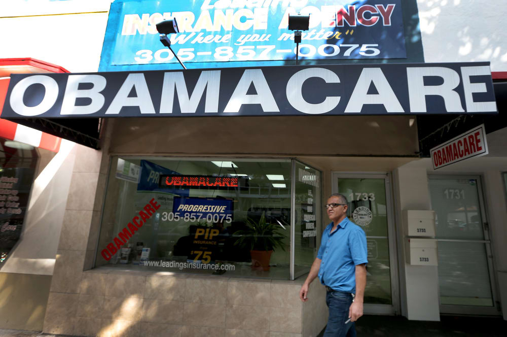 Hisham Uadadeh walks out of Leading Insurance Agency after enrolling in a health insurance plan under the Affordable Care Act on February 13, 2014 in Miami, Florida.
