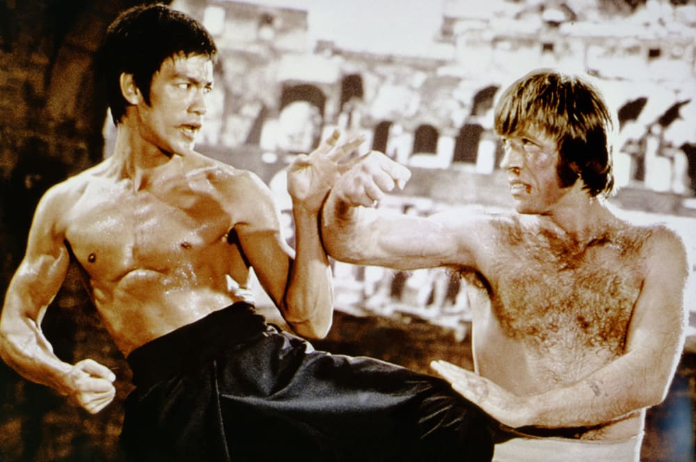 Bruce Lee, left, and Chuck Norris practice martial arts.