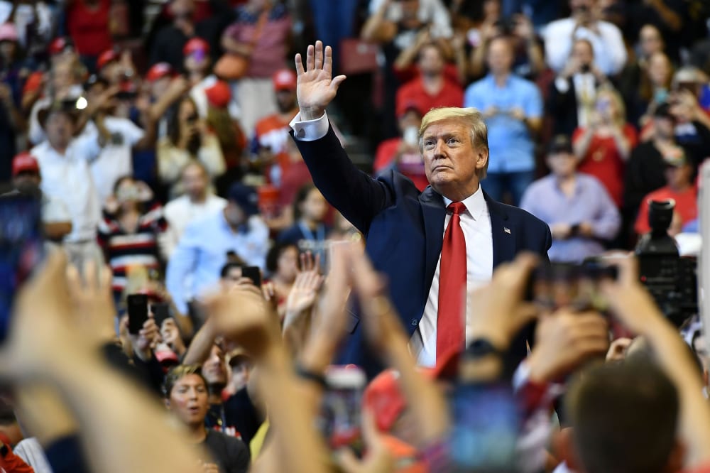 Image: President Donald Trump waves to supporters during a "Keep America Great" campaign rally in Sunrise