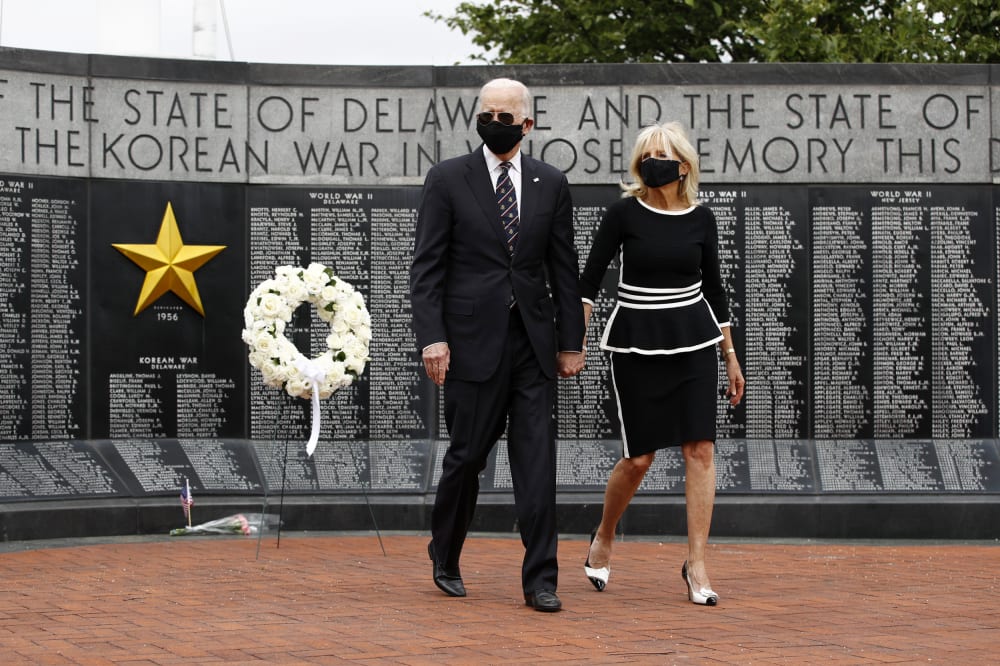 Image: Joe Biden and his wife, Jill, lay a wreath at the Veterans Memorial Park at the Delaware Memorial Bridge on May 25, 2020.
