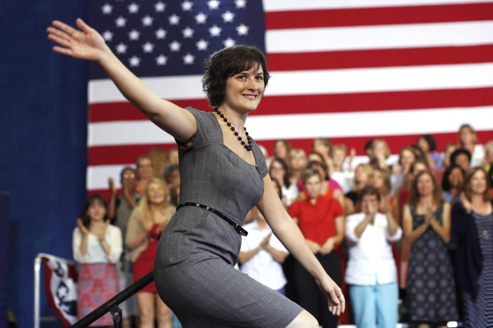 Sandra Fluke steps on stage to introduce President Barack Obama during an election campaign rally at the Auraria Event Center in Denver, Colorado, Aug. 8, 2012.