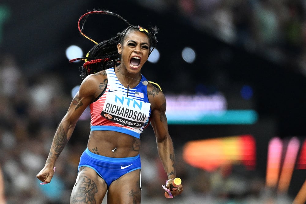 Sha'Carri Richardson after crossing the finish line to win the women's 4x100m relay final during the World Athletics Championships at the National Athletics Centre in Budapest