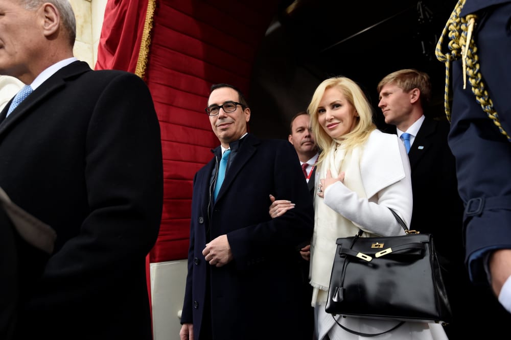 Image: FILE PHOTO: US Treasury Secretary nominee Mnuchin and Linton arrive for the Presidential Inauguration of Donald Trump at the US Capitol