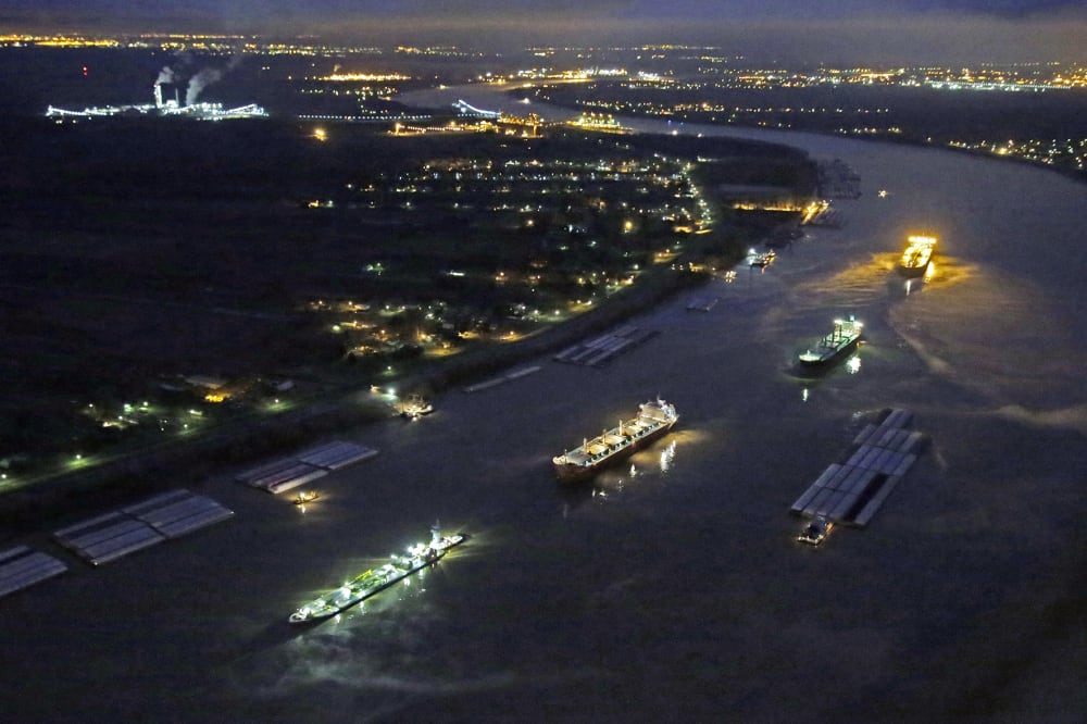 River traffic is halted along the Mississippi River between New Orleans and Vacherie, La., due to a barge leaking oil in St. James Parish, La., Feb. 23, 2014.
