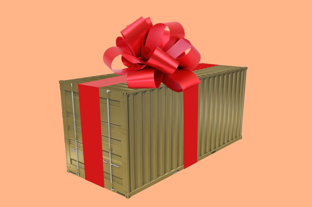 An illustration of a shipping container with a bow on top