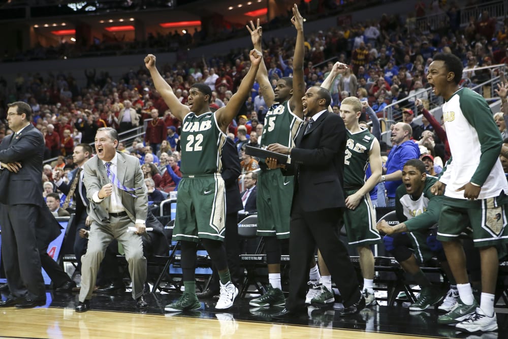 The UAB bench cheers after guard Robert Brown hit a 3-point basket in the closing seconds of the second half against Iowa State in the second round of the NCAA college basketball tournament in Louisville, Ky., March 19, 2015.(Photo by David Stephenson/AP)