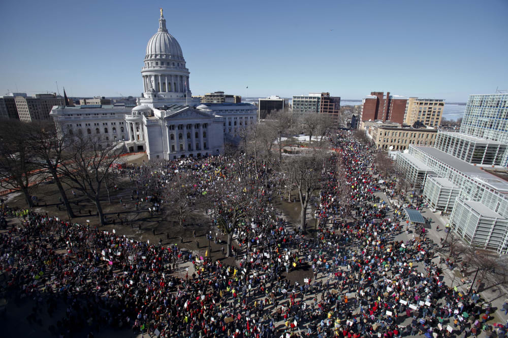 Protesters gather outside the state Capitol in Madison, Wis. on Saturday, Feb. 19, 2011.