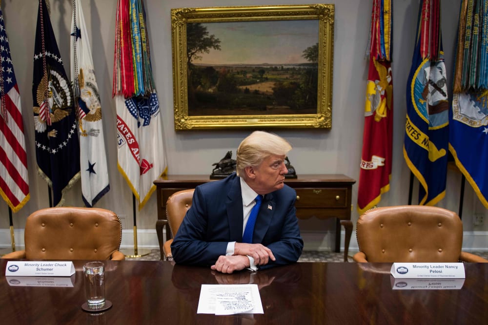 U.S. President Donald Trump makes a statement from the Roosevelt Room next to the empty chairs of Senate Minority Leader Chuck Schumer (L), D-New York, and House Minority Leader Nancy Pelosi (R), D-California, after they cancelled their meeting at the Whi