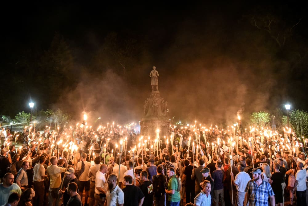 White nationalists march on the grounds of the University of Virginia ahead of the "Unite the Right Rally" in Charlottesville on Aug. 11, 2017.