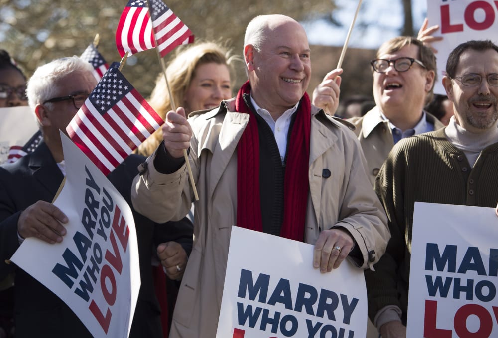 Robert Roman and Claus Ihlemann of Virginia Beach celebrate with Carol Schall, Mary Townley , Tim Bostic and Tony London, Thursday's ruling that Virginia's same-sex marriage ban was unconstitutional.