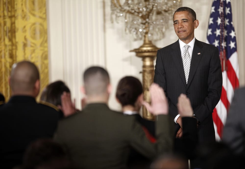 President Barack Obama, watches as the Oath of Allegiance is administered at a naturalization ceremony for active duty service members and civilians, Monday, March 25, 2013, in the East Room of the White House in Washington. (AP Photo/Pablo Martinez...